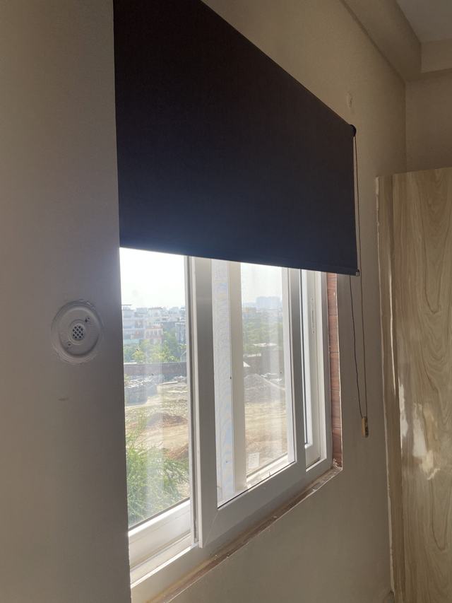 Window with blackout roller blind